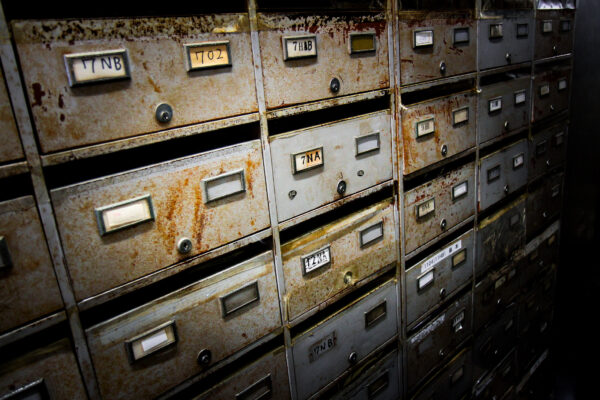 Abandoned rusty metal lockers in Shinjuku, showcasing times effects in a forsaken space.