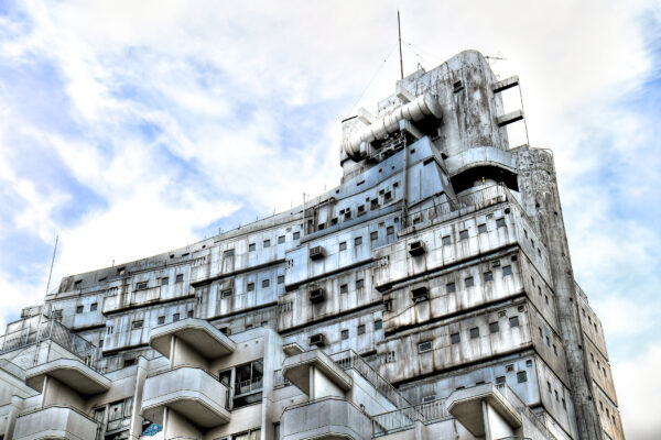 Metabolism Tower in Shinjuku, a futuristic architectural marvel with angular shapes and sleek design.