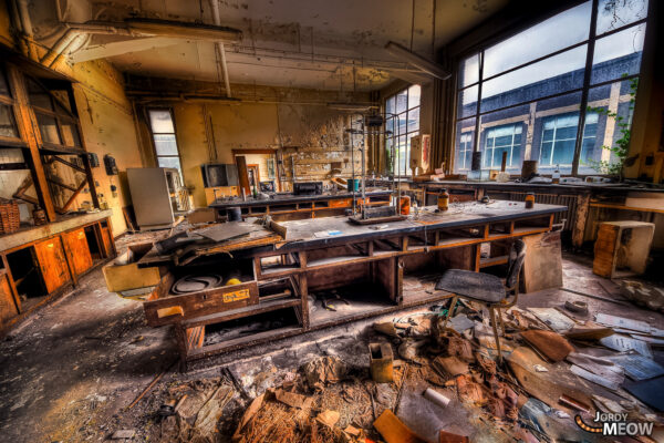 Decaying industrial workspace in Belgium - abandoned, rusty machinery, melancholic neglect.