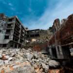 The Haunting Ruins of Gunkanjima: Abandoned Movie Theater in Nagasaki, Japan.