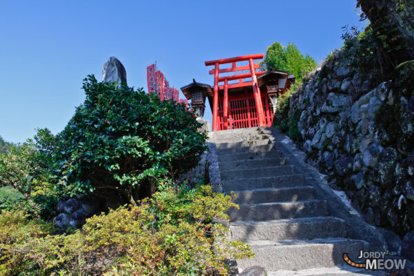 Serenity at Gifu Shrine: Red Torii Gate in Japan.