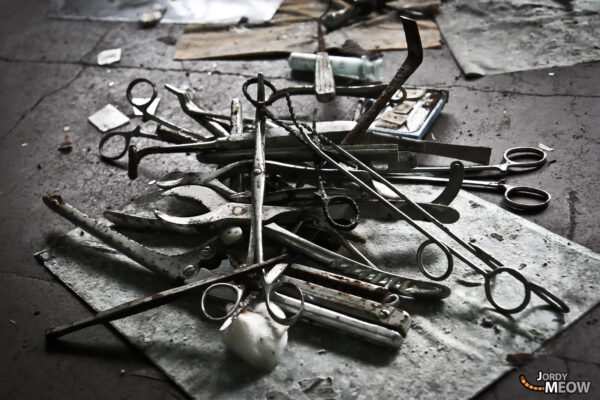 Abandoned tools in eerie Nichitsu Ghost Town, Japan, capturing haunting urban decay.