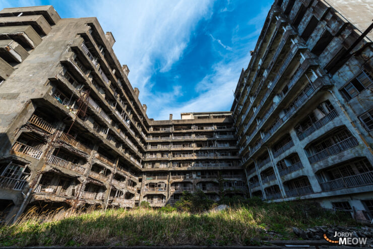 Discover haunting beauty of Gunkanjima: abandoned island ruins in Nagasaki, Japan.