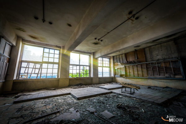 The Lost Melody: Abandoned Gunkanjima Piano, symbolizing forgotten past in Nagasaki, Japan.