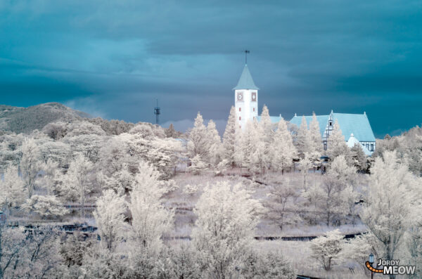 Exploring haunting beauty in snow-covered Chugoku theme park ruins.