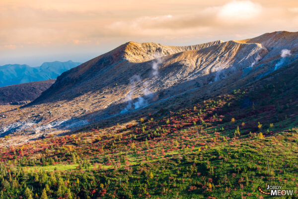 Explore the breathtaking beauty of Mount Shirane in autumn, a geological wonder in Japan.