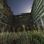 Abandoned urban landscape on Gunkanjima: Block 65 at night.