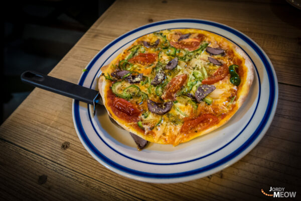 Savory Japanese Veggie Flatbread with Local Flavors on Wooden Plate