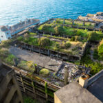 Explore the haunting beauty of abandoned apartments on Gunkanjima, Nagasaki, Japan.
