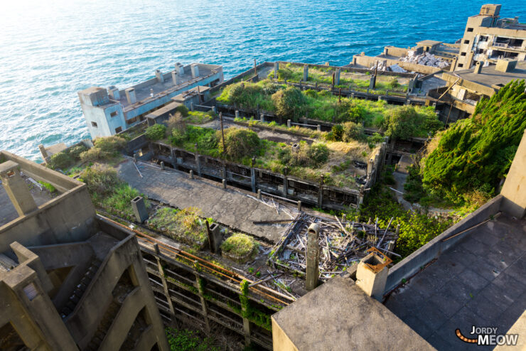 Explore the haunting beauty of abandoned apartments on Gunkanjima, Nagasaki, Japan.