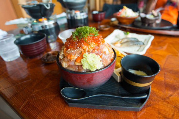 Delicious Ikura Donburi with Fresh Sashimi and Savory Sauce