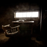 Abandoned accountants office on Gunkanjima, showcasing isolation and decay of Nagasakis ghost island.