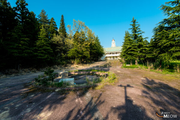 Exploring the abandoned Russian Village in lush Japanese landscape.