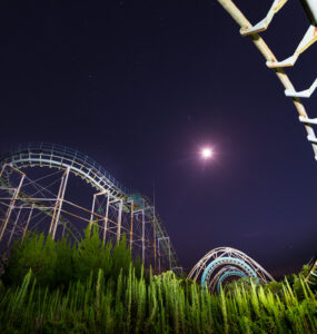 Eerie night view of abandoned Nara Dreamland Roller Coaster in Japan.