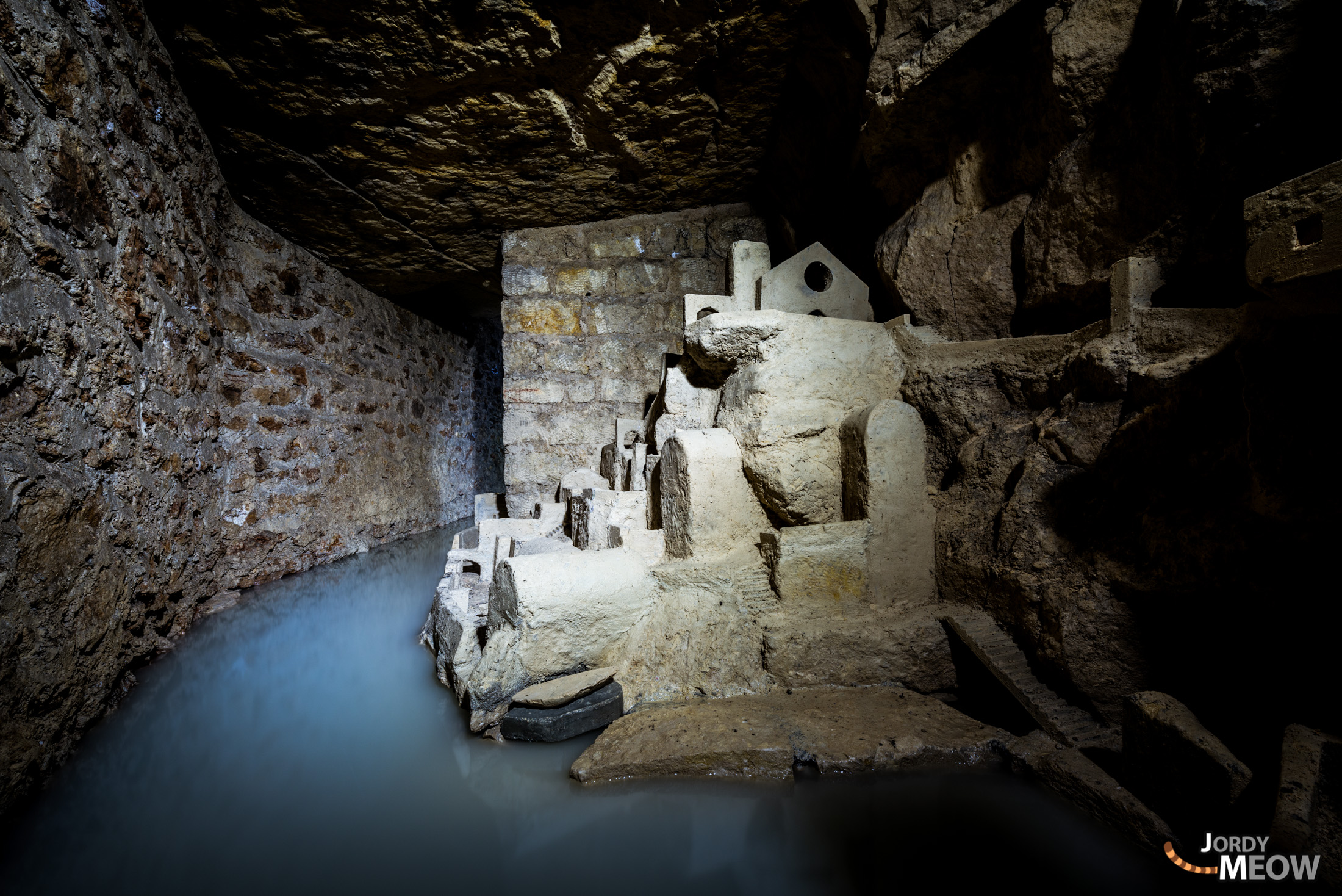 Discover the hidden depths of Parisian catacombs with ancient tunnels and skeletal structures.