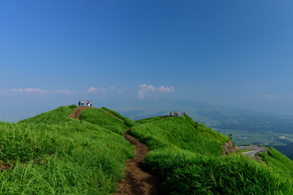 Enchanted Mountain Pathway - Tranquil hike through lush green hills, inviting exploration.