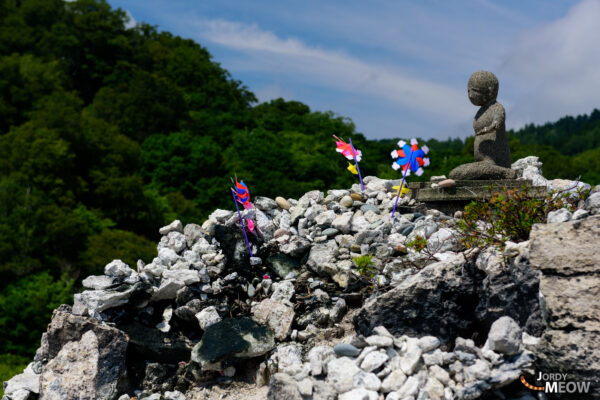 Spiritual Sanctuary: Mount Osore in Aomori, Japan - serene, mystical view with playful elements.