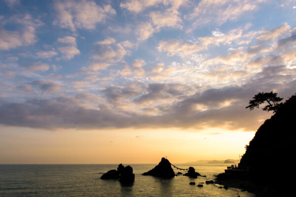 Sacred Meoto Iwa Rocks at sunset in Futami, Japan.