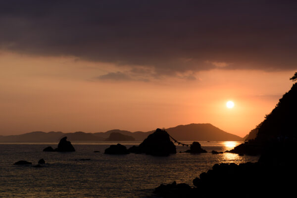 Sunset splendor at Meoto Iwa, Japan: stunning married couple rocks at golden hour.