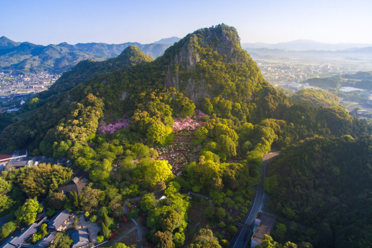 Tranquil Mifuneyama Park in Japan offers lush greenery, colorful flowers, and sweeping mountain views.