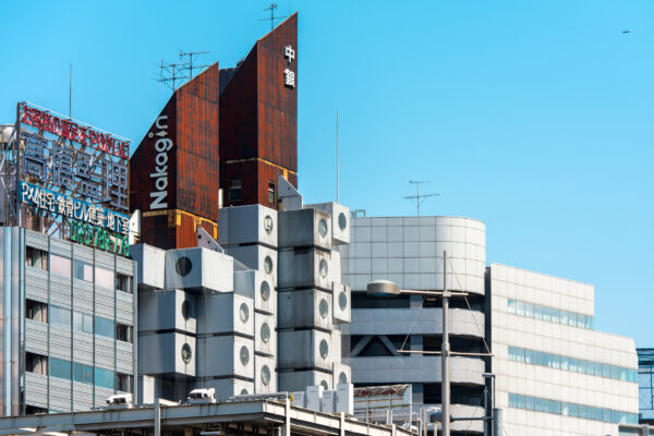 Iconic Metabolism Architecture: Nakagin Capsule Tower in Tokyo, Japan - Self-contained living and office spaces.