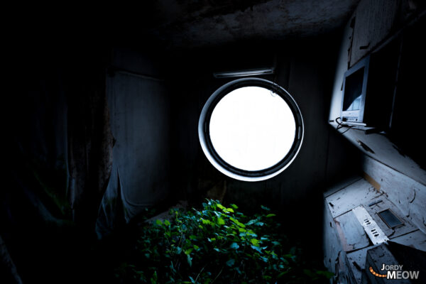 Modernist Nakagin Capsule Tower in Tokyo, Japan - iconic yet abandoned architectural marvel.