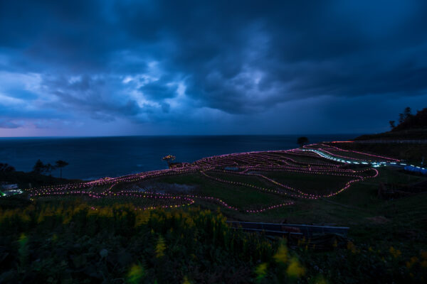 Enchanting Illuminated Rice Terraces in Shiroyone-machi, Wajima City, Ishikawa Prefecture.