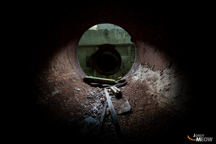 Abandoned hydro plant in autumn, nature reclaiming industrial ruins in Tohoku, Japan.