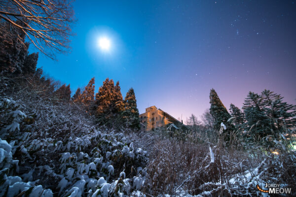 Hirugano Height Hotel: Eerie beauty of abandoned Japanese ruin in snow-covered landscape.