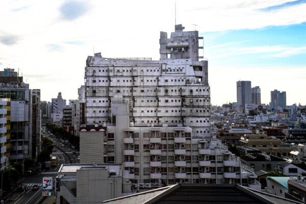 Urban skyline featuring the striking New Sky Building in a modern metropolis.