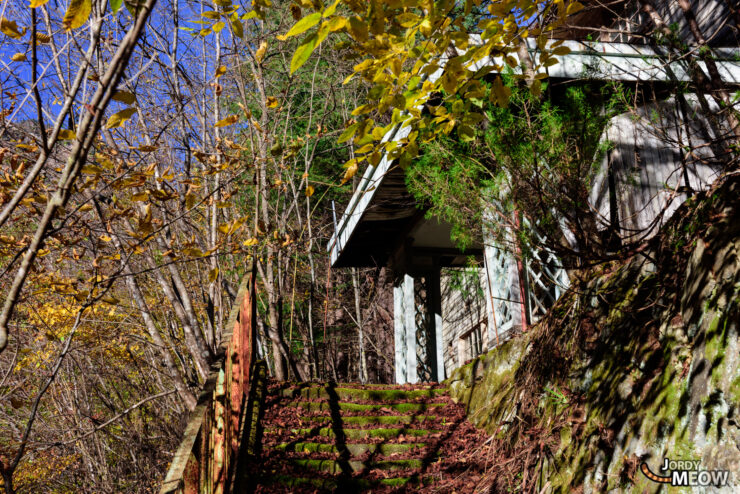 Exploring abandoned Nichitsu Mine in beautiful autumn sunset, hinting at mysterious past.