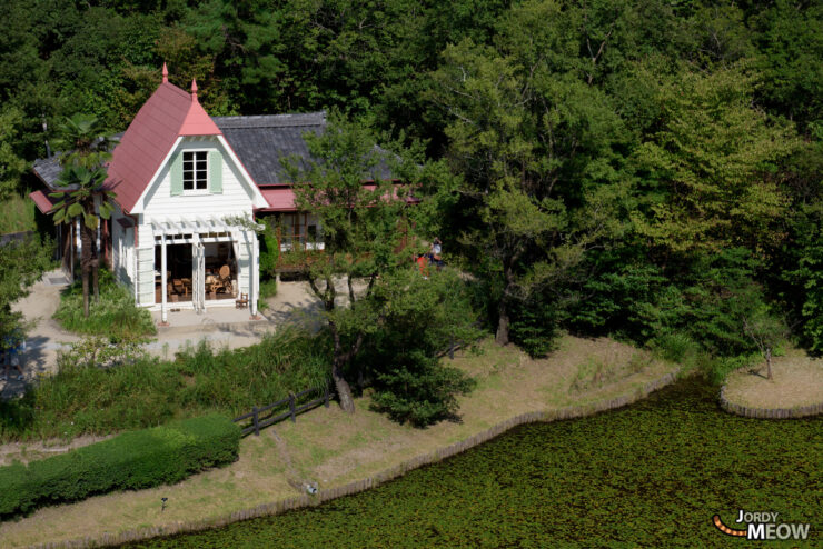 Charming Totoro House replica in Nagoya, Japan - whimsical design nestled in lush greenery.