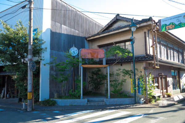 Charming Japanese town with vibrant colors, mix of old and new architecture.