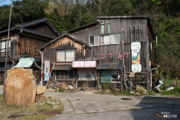 Discover the charm of Manabe-shima Island in Japan with traditional houses, historic sites, and cats.