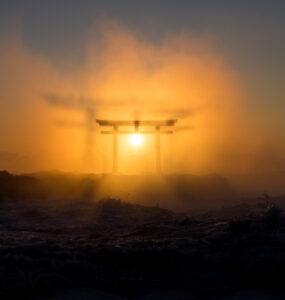 Tranquil sunset at Oarai Isosaki Shrine in Japan, with iconic torii gate.