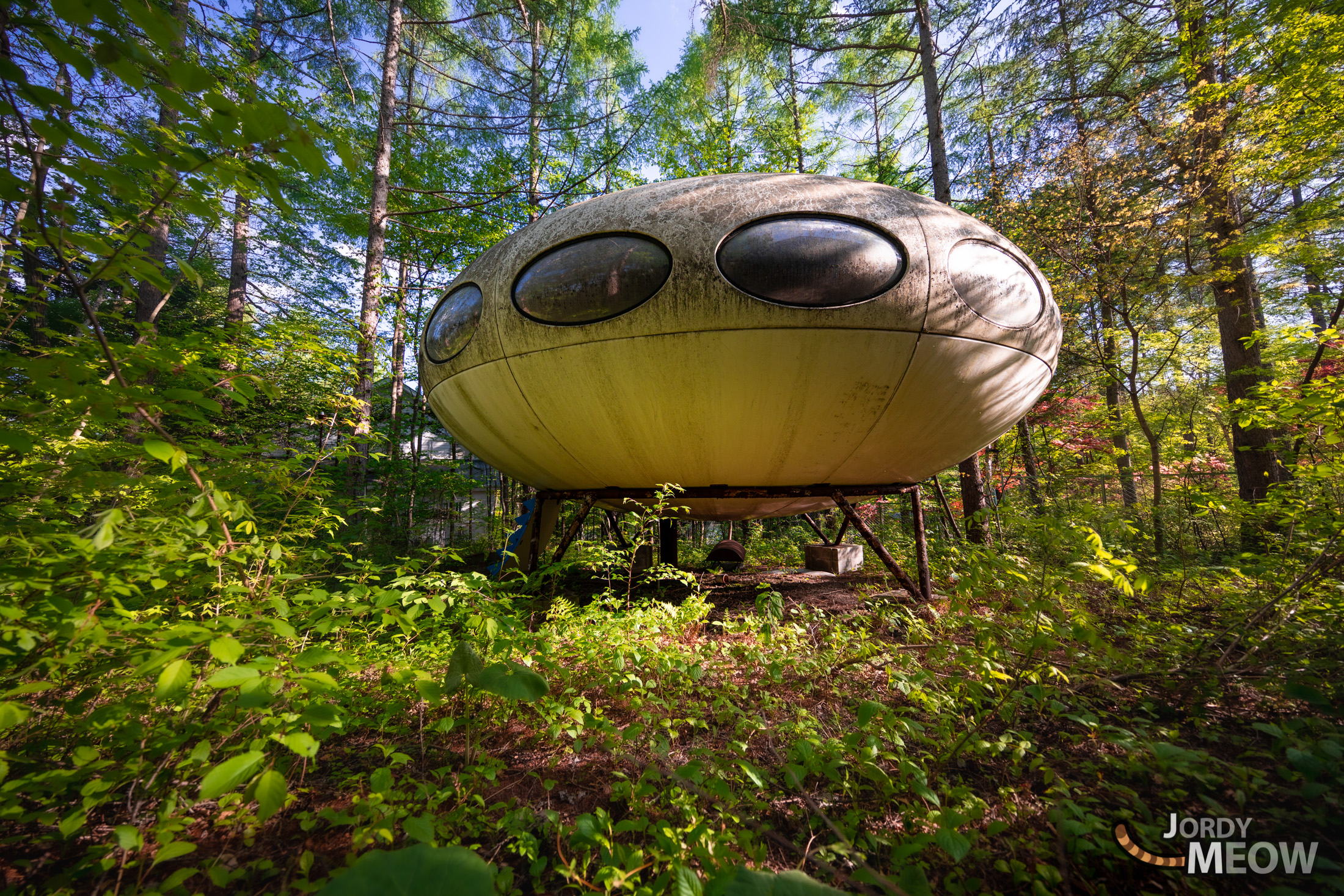 Abandoned Futuro House in Lush Japanese Forest