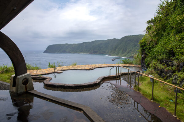 Scenic Coastal Onsen with Mountain Views