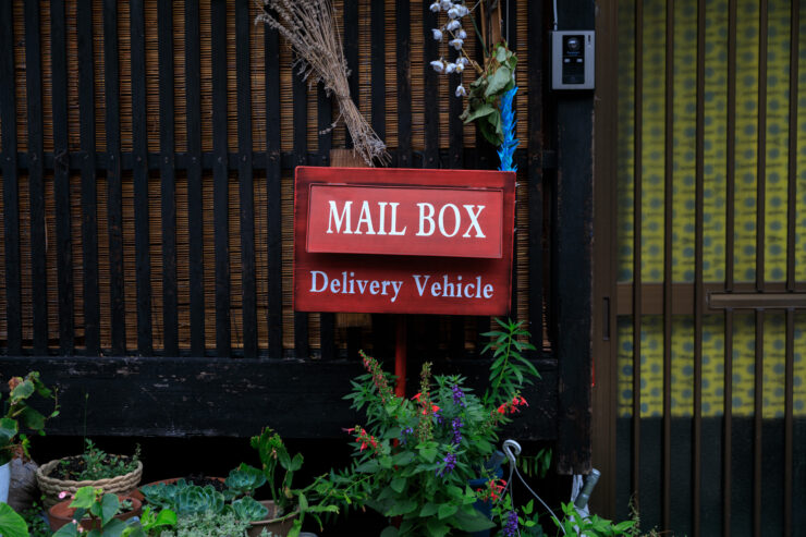 Rustic red wooden mail drop Takehara Hiroshima