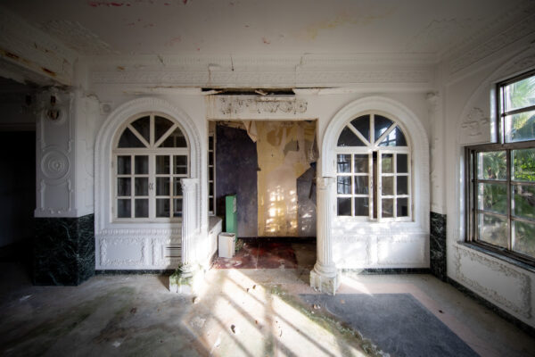 Abandoned opulent Hachijo hotel, crumbling grandeur.