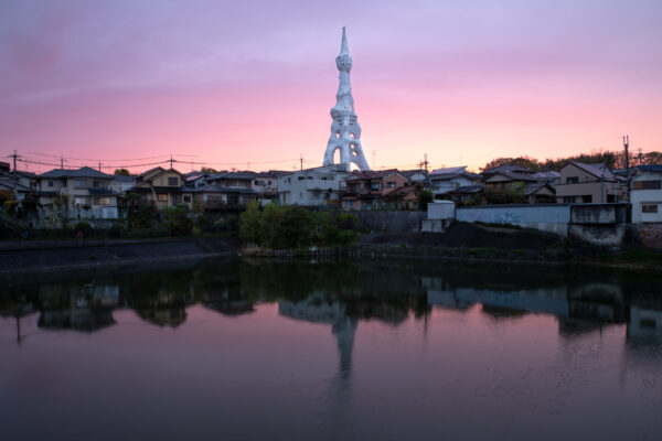 Serene sunset reflection of ornate Memorial Peace Tower.