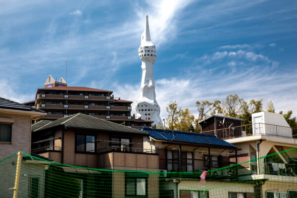 Great Peace Monument Tower in urban landscape, symbolizing unity and peace.