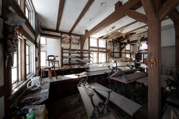 Decaying machinery in abandoned workshop interior