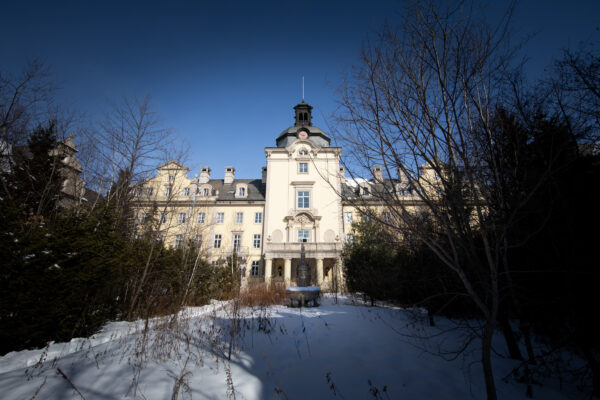 Abandoned ornate castle theme park winter wonderland.