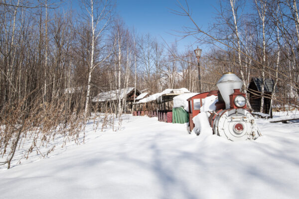 Abandoned winter wonderland theme park scene