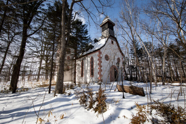 Abandoned snow-covered theme park winter landscape.