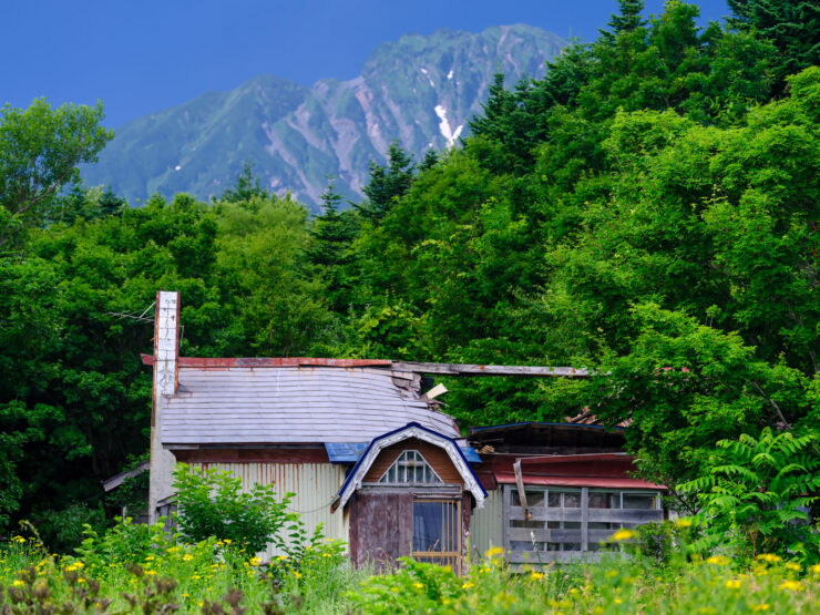 Towering snow-capped peaks, lush greenery on Rishiri Island, Japan.