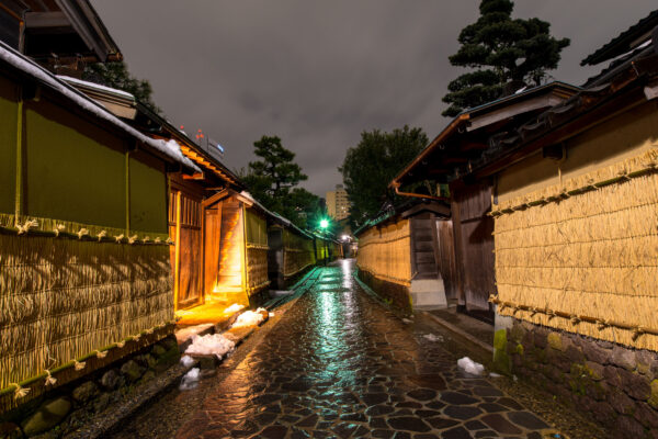 Historic Kanazawa alleyway glows at night.