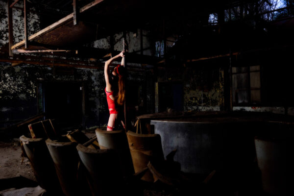 Vibrant dancer in abandoned urban setting