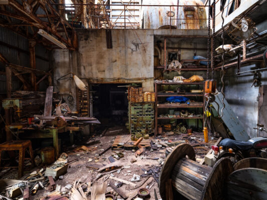 Abandoned industrial interior, cluttered decay