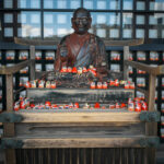 Illuminated Buddha statue, Japanese temple altar